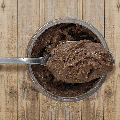 Chocolate Peanut Butter top view of open container with spoon full of peanut butter